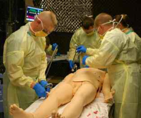 Figure 2: Initial assessment of a simulated patient by members of a Forward Surgical Team.