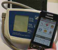 Figure 1: A patient transmits his recently measured blood pressure values simply by bringing his Near Field Communication (NFC) enabled mobile phone close to the NFC enabled blood pressure device (UA 767 plus NFC, A&D Company, Tokyo, Japan).