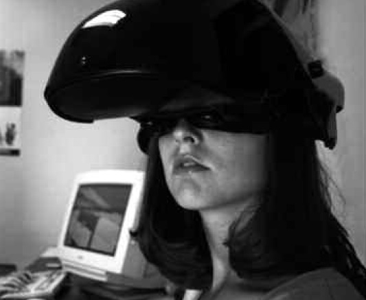 The Client wears a headmounted display with small monitors to receive both visual and auditory cues